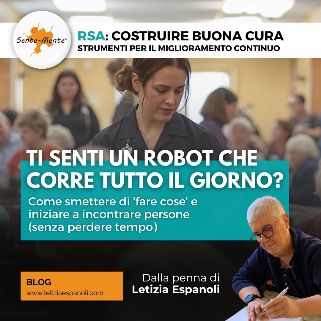 Operatrice in RSA che si ferma accanto a una persona anziana durante un momento di cura